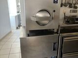 a kitchen with a stove, oven, and other appliances in it