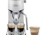 an image of a coffee machine with two cups and a cup of coffee