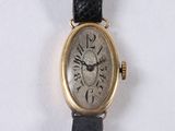 a watch that is sitting on a white surface