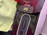 a red and black toaster sitting on top of a rack