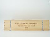 a wooden box with a label on it that says chateau belar - monne
