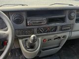 a dashboard of a car with a steering wheel and dashboard controls