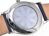 a close up of a watch on a white surface