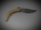 an image of a knife on a gray surface