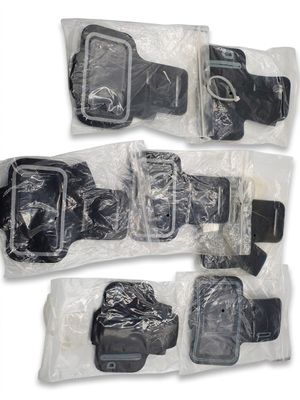 four pieces of luggage that are wrapped in plastic bags