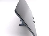 a close up of a laptop on a stand on a white surface