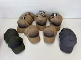many hats that are sitting on a table