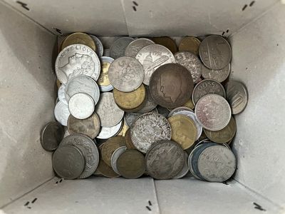a box full of coins sitting on the floor