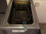 an image of a commercial fryer in a public kitchen