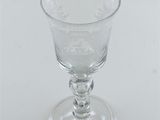 a clear glass with a design on it on a white surface