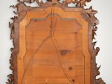 an image of a wooden mirror hanging on a wall
