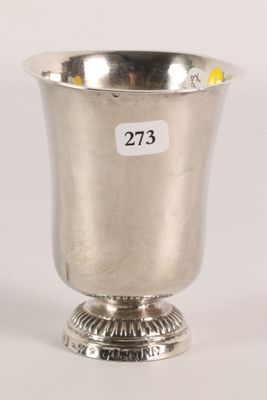 a close up of a silver cup on a pedestal with a price tag