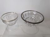 a glass bowl and a glass bowl sitting on a table