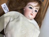 a doll that is laying down on the floor