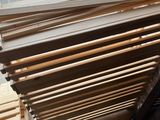many pieces of wood stacked on top of each other
