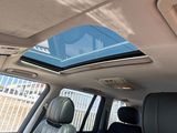 a view of the sunroof from inside of a car