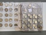 a lot of coins that are in a clear case