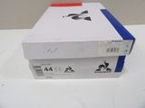 a white box with a red ribbon on top of it