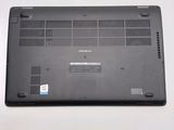 a close up of a laptop on a white surface