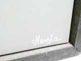 a close up of a picture of a window with graffiti on the window sill