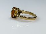 an image of a yellow gold ring with a citrine stone