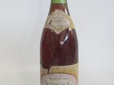 a bottle of wine that is sitting on a table