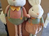 two stuffed animals that are sitting on a box
