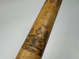 a baseball bat with a design on it on a table