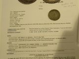 une image représentant une feuille de papier sur laquelle est posée une pièce de monnaie