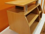 a desk with a shelf on top of it in a room