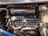 a close up view of a car engine with its hood open