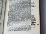 an open book with writing on it sitting on a table