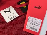 a close up of a red jacket with a tag on it
