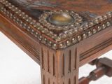 a close up of a wooden table with a leather top