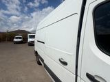 a white van that is parked in a parking lot
