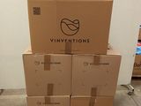 several cardboard boxes stacked on top of each other in a room