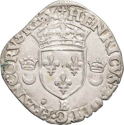a silver coin with a crown on top of it