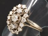 a close up of a ring with diamonds on it