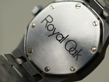 a close up of a watch with a logo on it