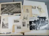 a lot of old black and white photos on a table