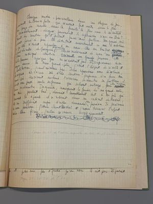 an open book with writing on it sitting on top of a table