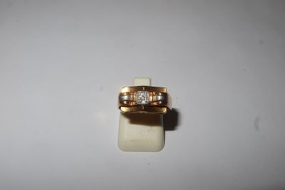 an image of a gold ring with two diamonds on it