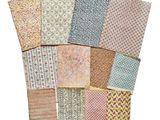 a pile of assorted patterned papers on a white background