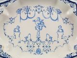 a blue and white plate with a design on it