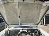 a car with its hood open and the engine in it
