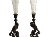 pair of antique glass vases on stand on white background