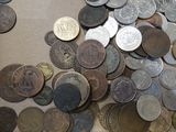 a box full of coins sitting on a table