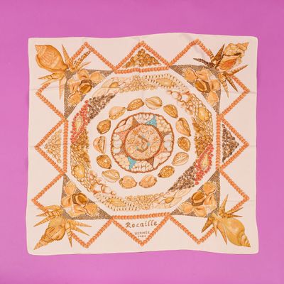 a picture of a square scarf with a picture of a rose on it