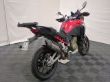 a picture of a red and black motorcycle parked on a checkered floor