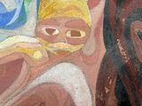 une peinture représentant une femme et un enfant sur un mur